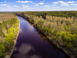 Fototapeta na wymiar drone image. aerial view of rural area with fields and forests with river and water reflections