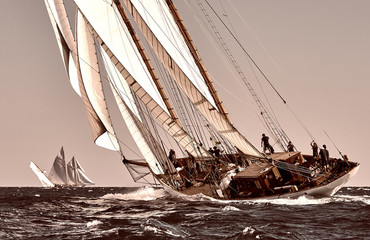 Naklejka premium Sailing ship yacht race. Yachting. Sailing. Regatta. Classic sail yachts and sailboats