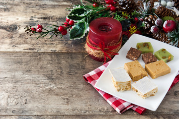 Christmas nougat on wooden table. Copyspace