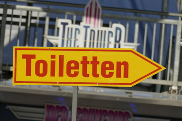 Obraz premium Toilettenschild, Wegweiser, Pfeil