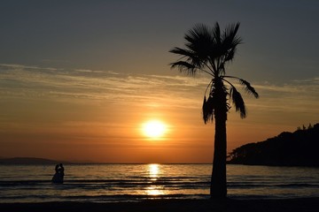  İn love.   Sunset on sea. Seascape. Seashore. Dawn in the resort town of Akyaka. The port of Akyaka. Autumn.