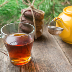 Homemade chocolate cookies with a glass cup of black tea