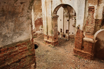 ruins of an old ruined church. red brick, ruined arches