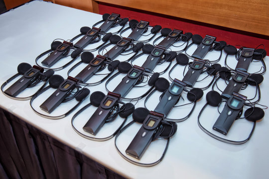 headphones used for simultaneous translation equipment simultaneous interpretation equipment . A set of headphones for simultaneous translation during negotiations in foreign languages.