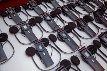 headphones used for simultaneous translation equipment simultaneous interpretation equipment . A set of headphones for simultaneous translation during negotiations in foreign languages.
