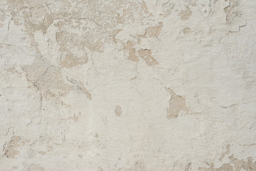 Fototapeta premium Wall fragment with scratches and cracks. It can be used as a background