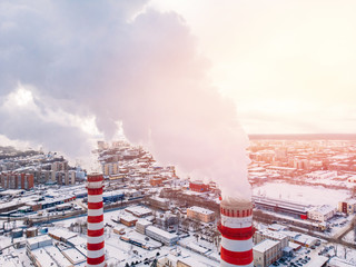 Aerial top view clouds of smoke and steam cooling tower industrial heat electro central coal.