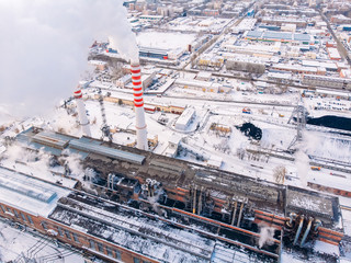 Aerial top view clouds of smoke and steam cooling tower industrial heat electro central coal.