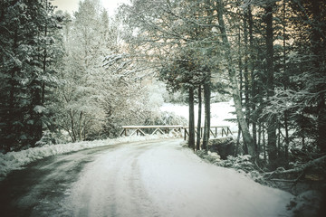 Highway that runs between a snowy landscape