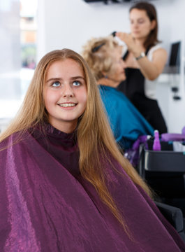 Teenage girl waiting for hair styling