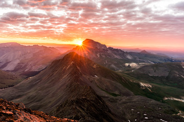 Dramatic Sunrise in the Colorado Rocky Mountains.  Photo taken from the summit of Wetterhorn Peak in the San Juan Range