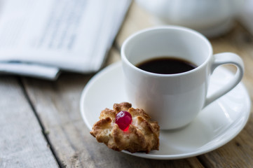 Sweet homemade cookies and cup of coffee on the table, selective focus and copyspace