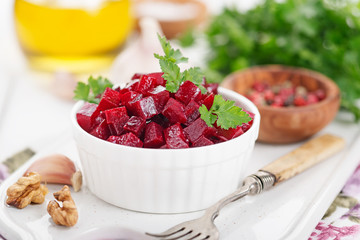 Healthy vegan beetroot salad with walnuts.