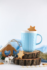 blue mug, ginger cookies and Christmas symbols on white background. New year's composition 2018
