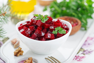 Healthy vegan beetroot salad with walnuts.