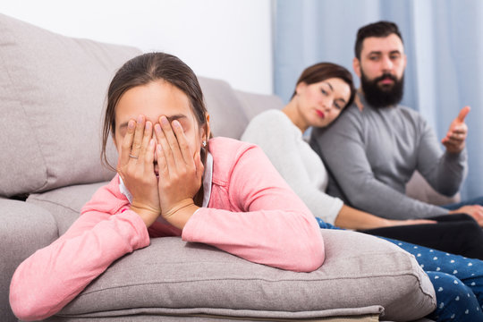 Parents lecturing daughter