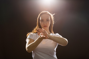 Fototapeta premium Hip-hop, jazz-funk, tecktonik, waacking, trance and street dances concept - Young woman dancing jazz-funk at studio