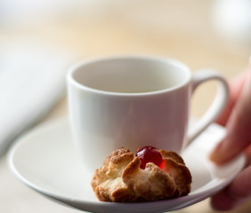 Sweet homemade cookies and cup of coffee on the table, selective focus and copyspace