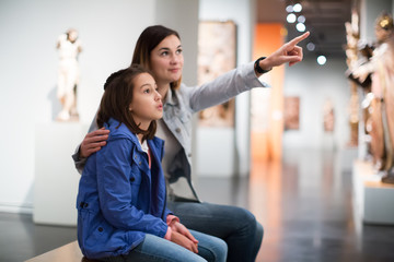 Mother and daughter in museum