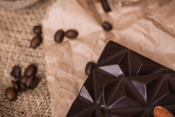 Dark chocolate with nuts on burlap.