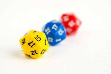 D20 yellow, blue and red dices for rpg, dnd or board games on light background