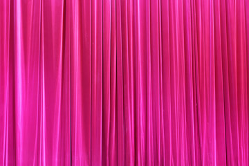 Photo Theatrical curtain of crimson color of velvet.