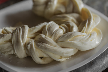 Cheese Chechil. Homemade soft cheese production. Dairy farm somewhere in Russia