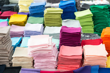 The stack of square pieces of colored fabric to showcase