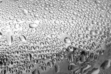 small water droplets on cold metal surface, condensate, black and white