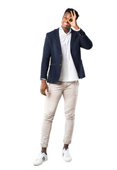 Full body of Handsome african american man wearing a jacket makes funny and crazy face emotion on white background