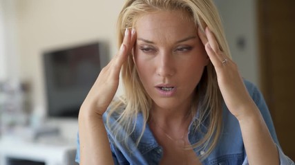 Young blond woman headache - Powered by Adobe
