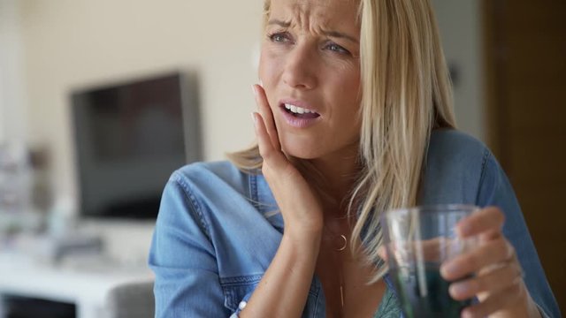Middle-aged woman having a toothache