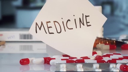 tablet rolls among medicines to inscription medicine, concept