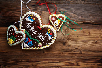 original bavarian christmas gingerbread heart on wood. xmas gingerbread cookie.