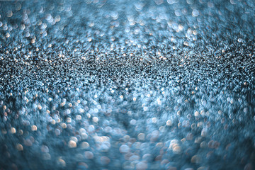 Magical blue abstract blurred sparkle background, festive.