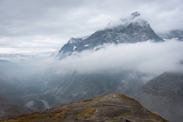 Mountain partly engulfed in clouds © Tobias