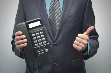 Phone with blank screen in the businessman hands isolated on the white background.