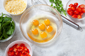 Fresh vegetables, eggs and cheese. Ingredients for healthy breakfast omelet