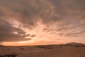 Sunset over the sand dunes in the Natural Park in Fuerteventura,Canary Islands,Spain.