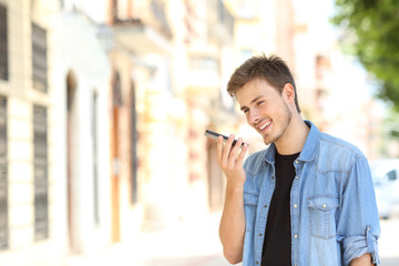 Boy using voice recognition on a smartphone