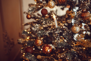 Dark Christmas background, closeup New Year ball Christmas tree.