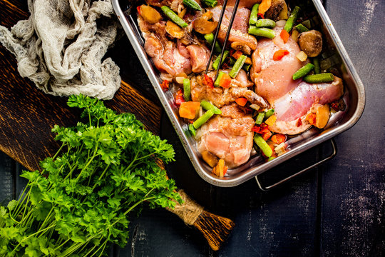 Prepared for baking chicken meat with vegetables.