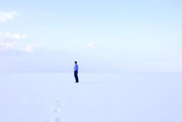 deadpan man standing shore frozen sea downshifting way relaxes winter seascape