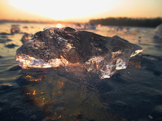 The sunset and the ice of lake