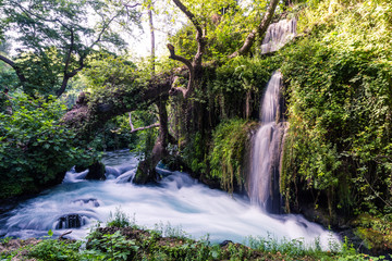 Great Duden Waterfalls is a beautiful tourist destination in Turkey near Antalya. Water falls from the rocks with trees and green grass. Water flows very quickly and gives freshness to nature. Good pl