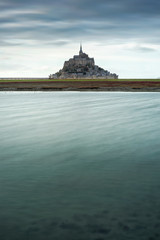 view to old castle with lake in long exposure in France