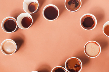 Frame of full and empty coffee cups with different types of coffee
