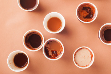 Full and empty coffee cups with different types of coffee