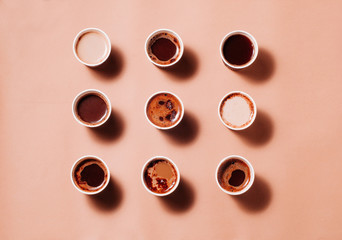 Geometric pattern of coffee cups with different types of coffee