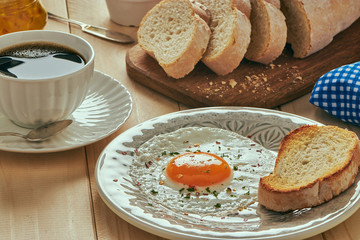 breakfast with egg, bread toast and coffe